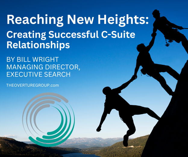 Two C-Suite executives climbing together